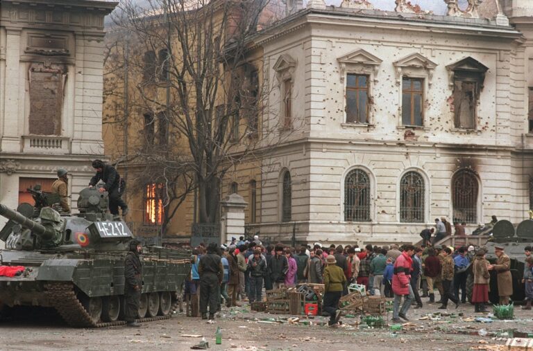 Romanian residents of Bucharest and army tanks soldiers are gathered in front of the destroyed Library building 25 December 1989. Romanian leader Nicolae Ceaucescu and his wife Elena has been executed 25 December 1989.,Image: 17379014, License: Rights-managed, Restrictions: , Model Release: no